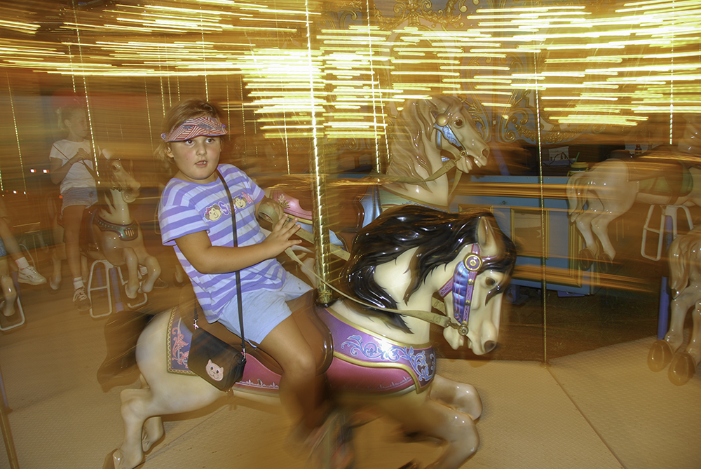Seven year old girl on a Merry-go-Round, Stanly County Fair, North Carolina. (MR)