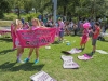 The gathering of protestors in Frazier Park, Charlotte, North Carolina prior to the Democratic National Convention, 2012.  This demonstration was sponsored by the Coalition to March on Wall Street South with over 80 groups with separate issues involved. Here the "Code Pink" group prepares to march.