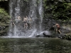 People swimming below the Waterfall of Los Angeles in Atenas, Costa Rica. Note the volcanic columnar rock formation.