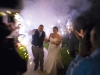 Bride and Groom passing through friends with sparklers as they leave the reception following the wedding.