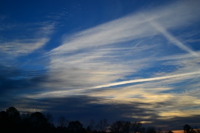 Wispy Cirrus clouds and vapor trails at sunrise, Piedmont of North Carolina.